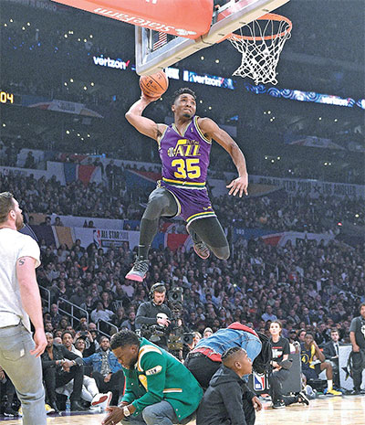 The Latest: Jazz rookie Mitchell wins slam dunk contest