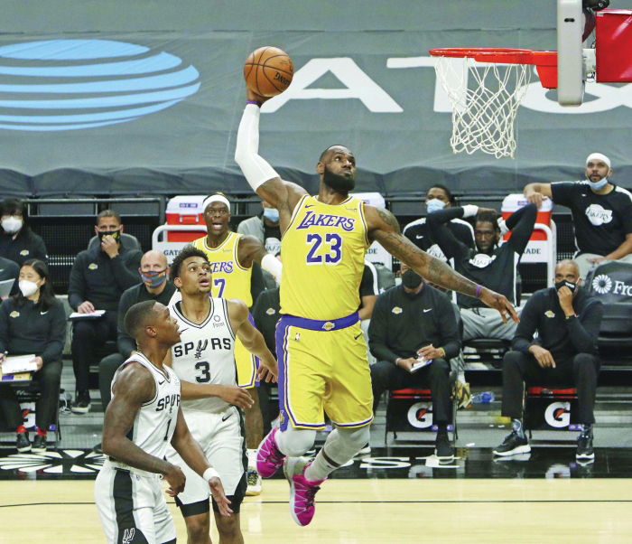 LeBron James of the Los Angeles Lakers dunks against the Brooklyn News  Photo - Getty Images