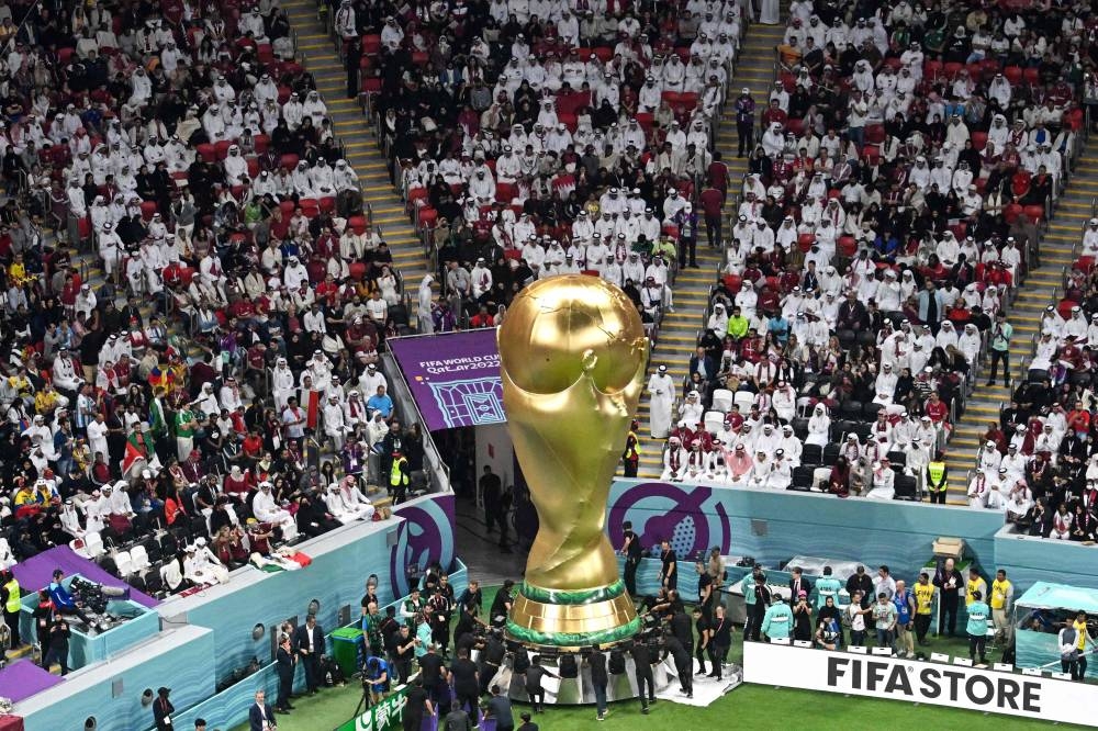 25th November 2022; Al Bayt Stadium, Al Khor, Qatar; FIFA World Cup  Football, England versus USA; England fan kissing a replica FIFA World Cup  trophy Credit: Action Plus Sports Images/Alamy Live News